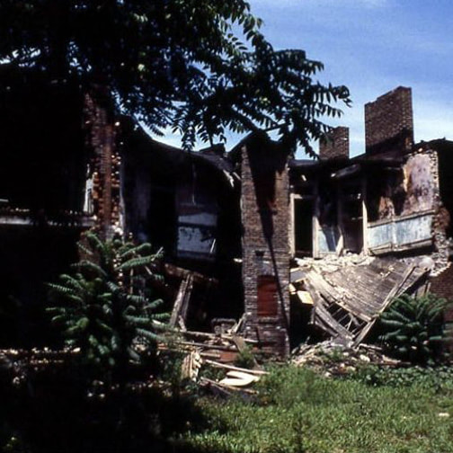 The Scott Joplin House before restoration, its roof and floors collapsed and only the brick chimney stacks left standing